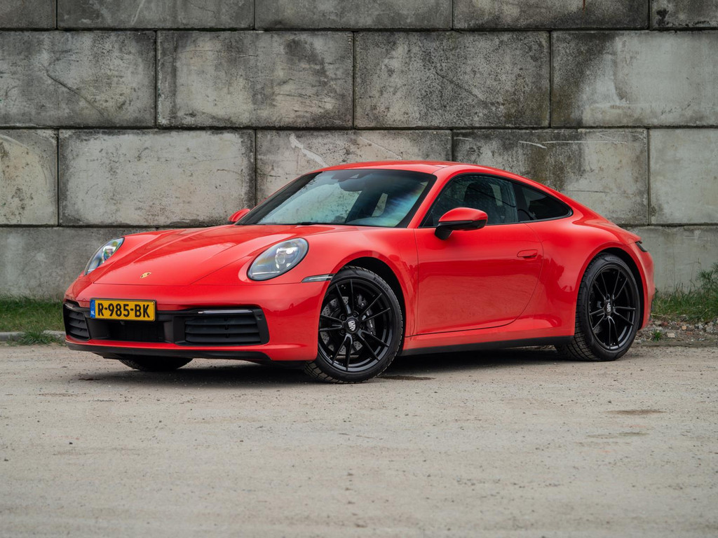 Porsche 911 Carrera 992 3.0 PDK 385PK (2020) | Sportuitlaat | Schuifdak | Sportstoelen | DealerOH | Compl. Historie | Indisch Rood 49122261-0.jpg | STR8SiX Automotive